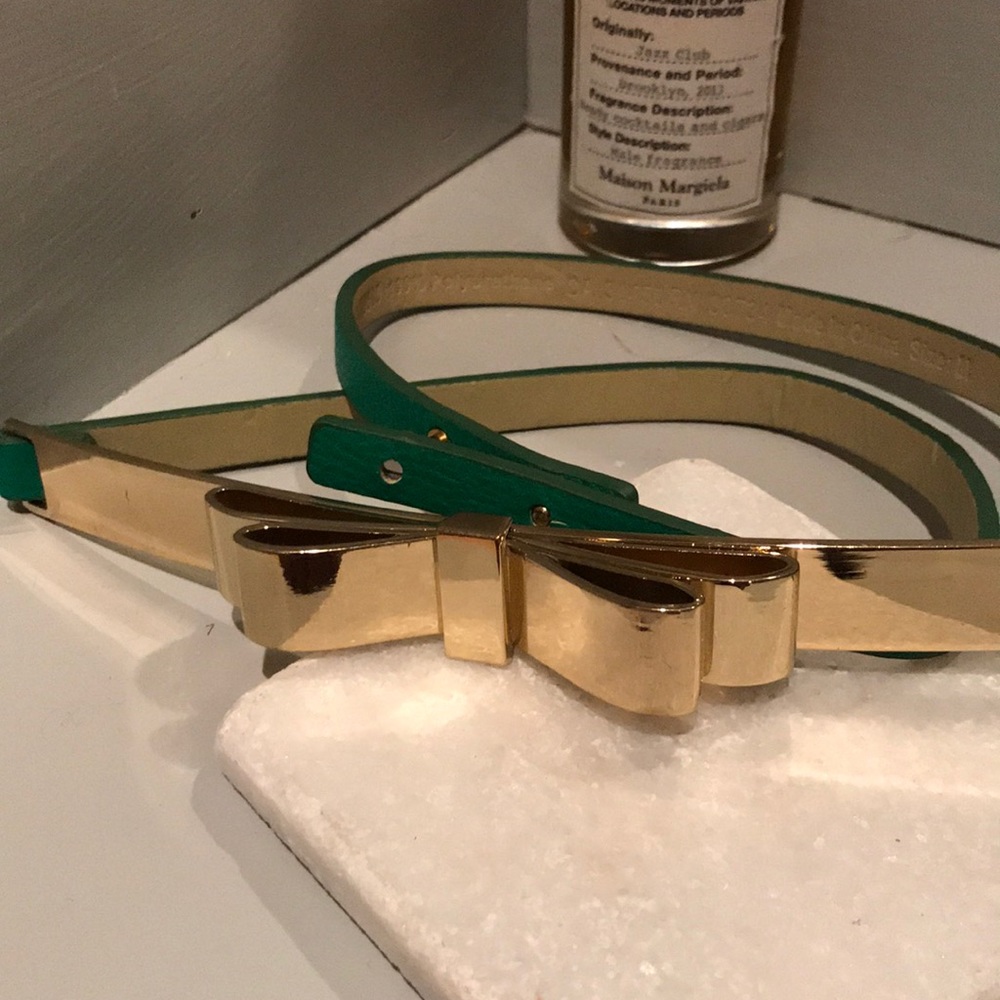 BCBG green belt with gold bow accent